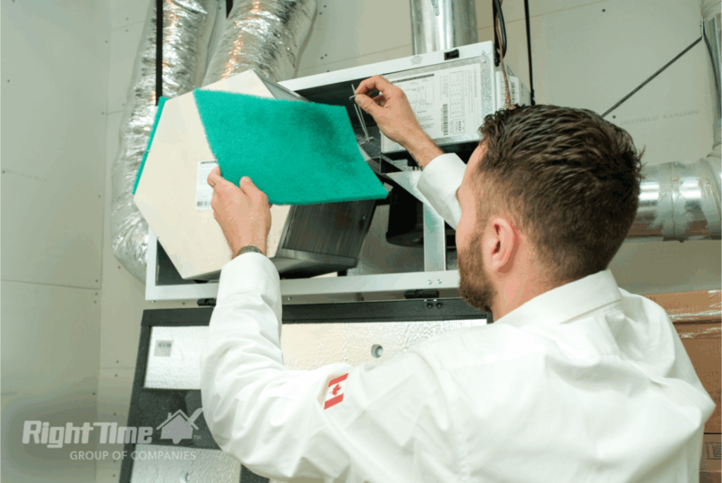 HVAC technician replacing air filter in mechanical room showing most common HVAC problems maintenance in Scarborough